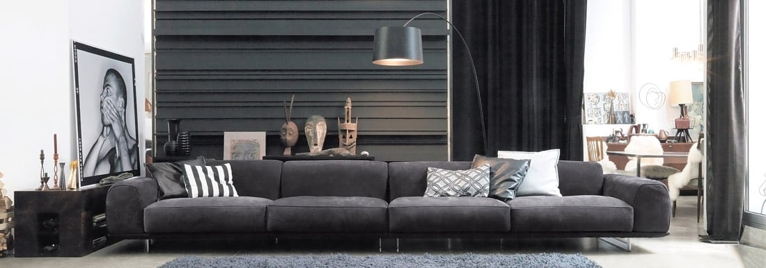 Black Modern leather sofa from Gamma with black accents and fixtures