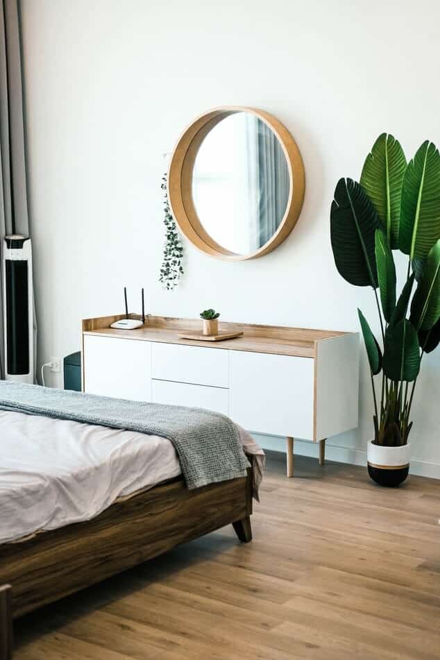modern bedroom with contemporary mirror and bed