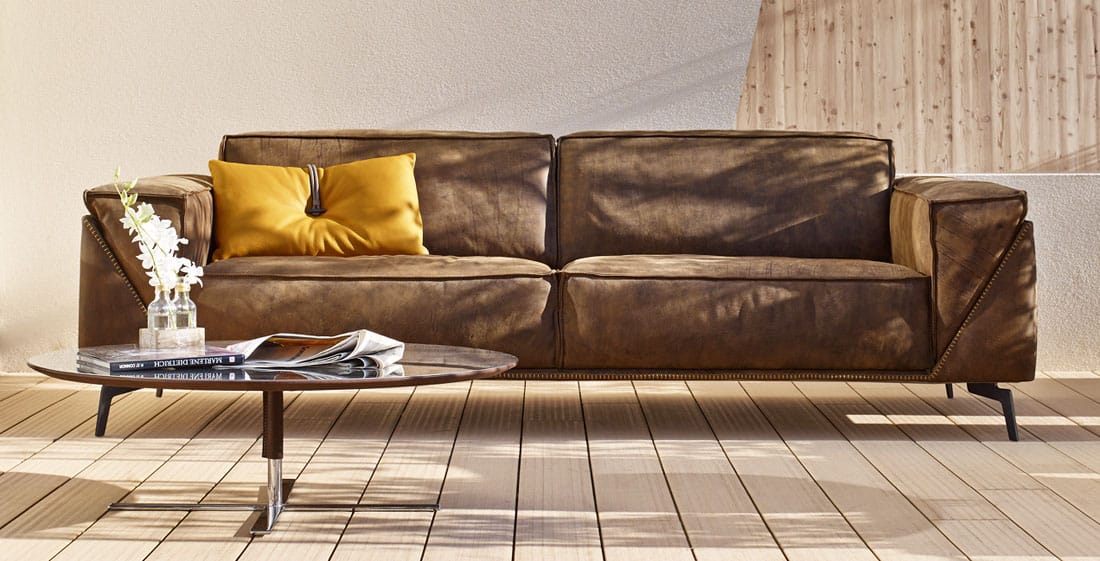 Contemporary Gamma leather sofa with modern coffee table