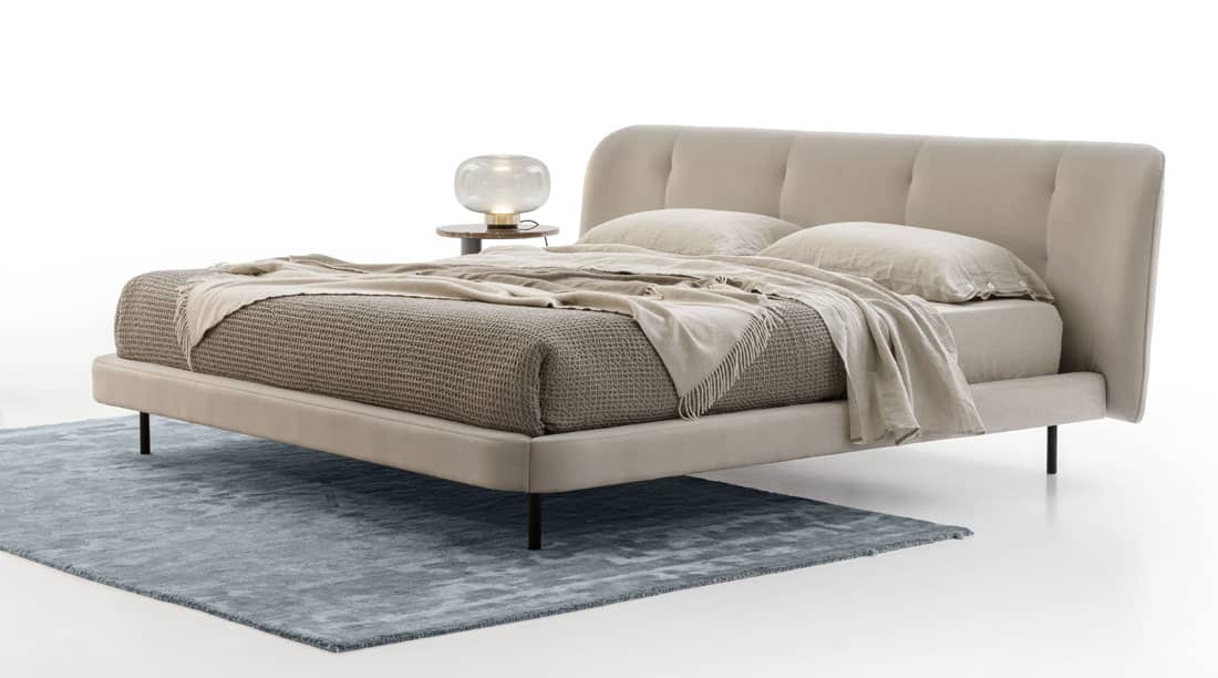 Upholstered bed frame and rug