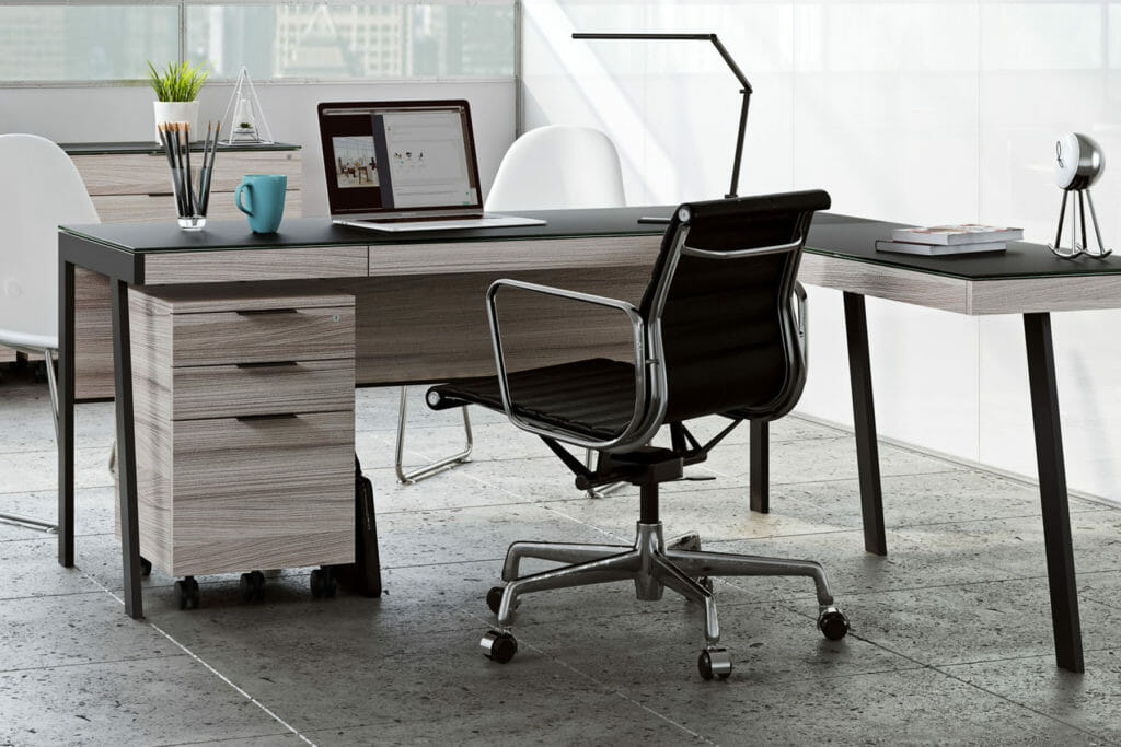 Modern & contemporary wood desk with a black leather rolling chair.