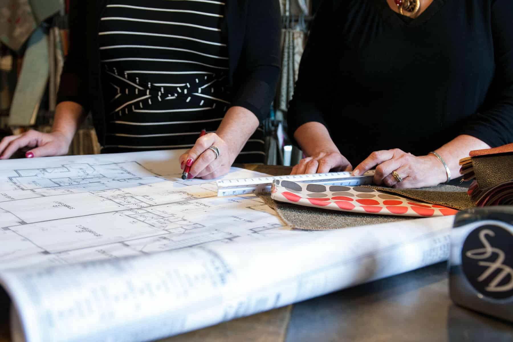 Utah Interior Designers Studying Home Blueprints and Color Schemes