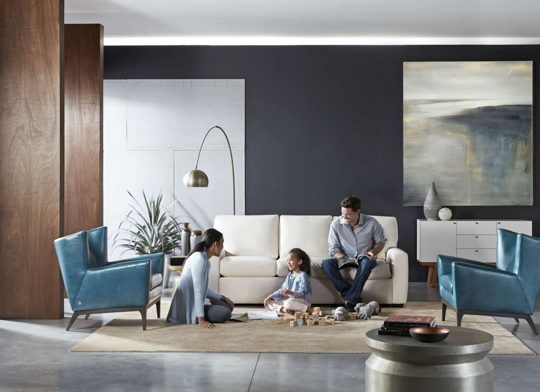 Family Playing in Living Room with Modern Sofa & Accent Chairs